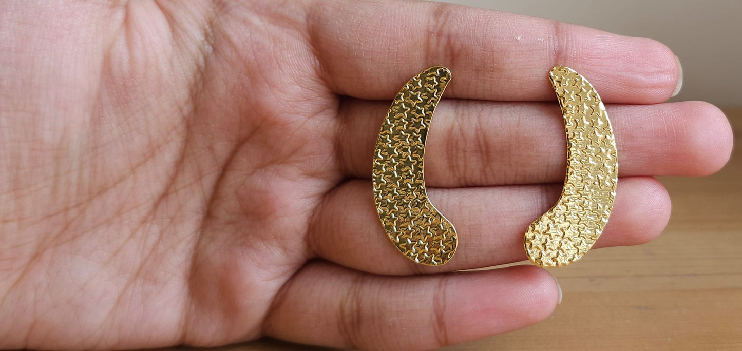 Crescent- shaped brass ear studs